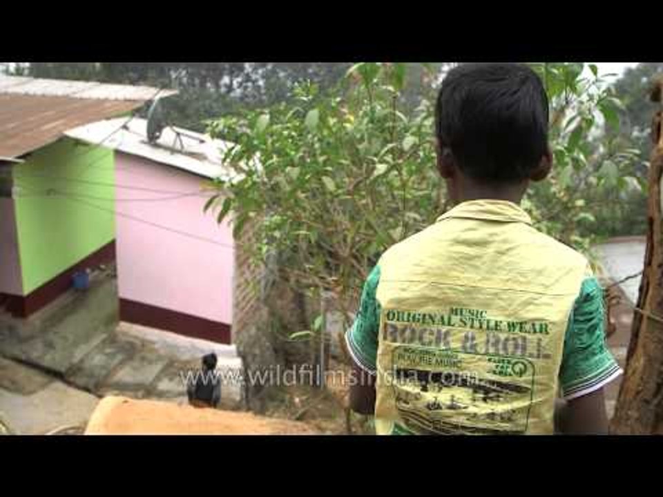 A boy rinsing his mouth after brushing - Assam
