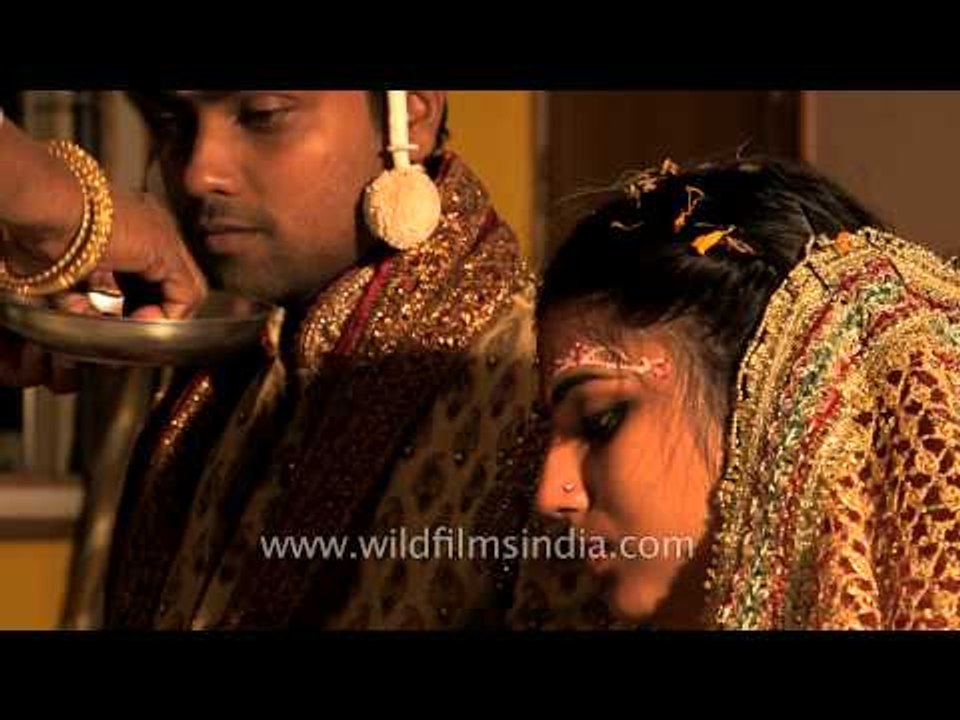 Newly wed couple being blessed by relatives : Bengali wedding