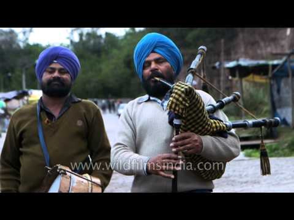 Sikh musicians perform on a road - Punjab