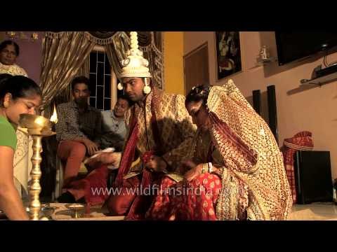 Relatives blessing the newly married couple