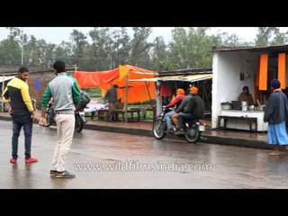 Religious items for sale in stalls outside Patalpuri Sahib Gurudwara