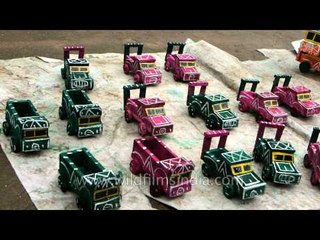 Wooden toy trucks on sale outside Dargah Peer Sai Baba Budhan Shahji