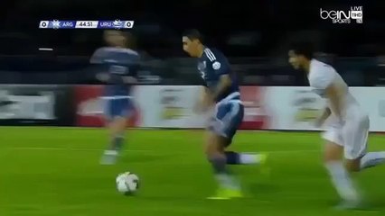 Angel Di Maria nutmegs Uruguay player while dribbling at full speed