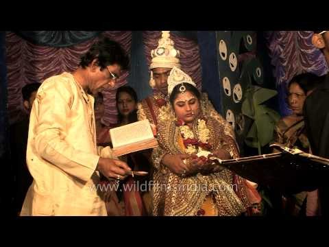 Rituals being performed at Bengali wedding