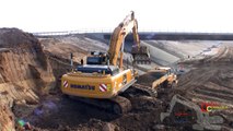 Komatsu PC450LC-7 Excavator Loading Cat 735B and Volvo A30 Dumpers