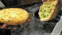 London Street Food. Cooking the Spanish Potato Tortilla with Ham