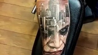 Amazing tattoo work London city and a face