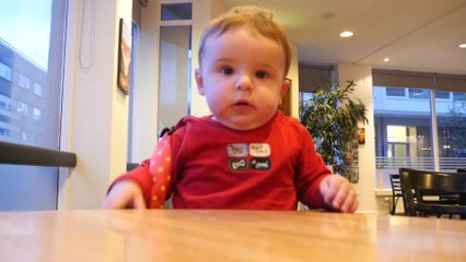 Playful baby can't help but laugh after snorting