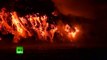 Wolf volcano lava boils into ocean (night footage)