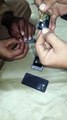Dont Do This Stupidity, He is removing NFC chip, That not spy chip