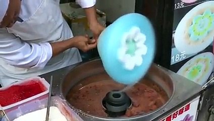 chinees guy's cotton candy game is on the [point.
