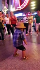 baby dancing for tips at Freemont Experience