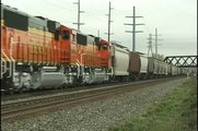 NEW BNSF locomotives lead Conrail Train BUEL at Blasdell, NY. 5-15-99. Time 10:45am.