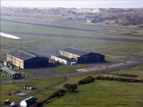 Daredevil pilots fly through hangar at a time from just one meter height from ground