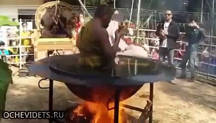 Thailand Monk meditate in boiling oil -