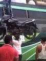 OMG!!! Man or BATMAN - This guy can Lift motorcycle on head alone