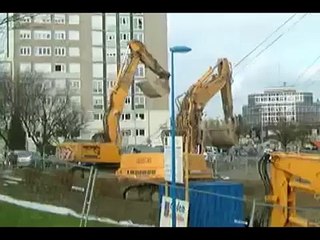 Demolition by Pulling down building with steel cables