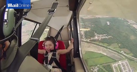 This girl flying in her dad s stunt plane is the cutest thing you ll see today
