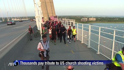 Thousands form 'unity chain' for Charleston shooting victims