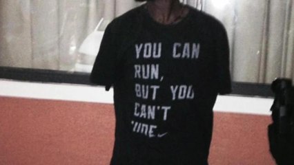 Fugitive arrested wearing "You can run, but you can't hide" shirt