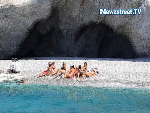 Kate Hudson hits the beach for topless sunbathing session