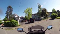 Motorcycle driver chasing a car driver who just hit another biker