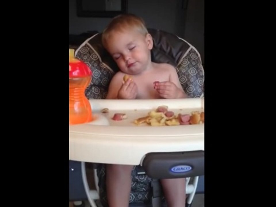 Baby falls asleep while eating in his highchair
