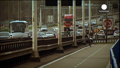 Dutch court orders Netherlands to cut carbon emissions faster