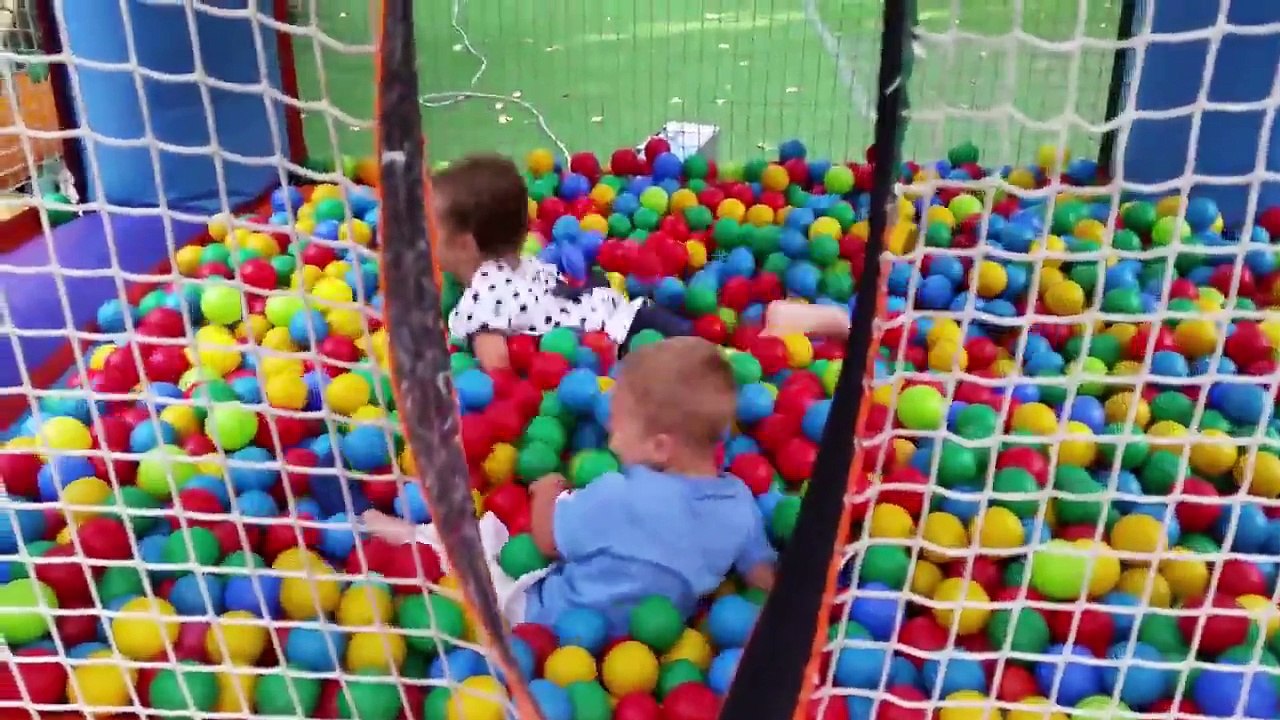 Kids playing . Play place with balls .Children in playground .Cute and funny video for kid