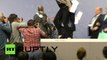 Jump around: Protester besieges ECB president Draghi, disrupts presser