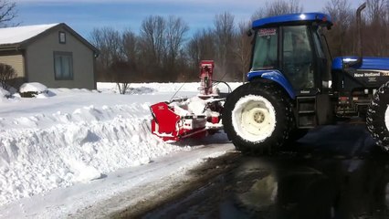 Bi directional New Holland tractor with Pronovost PXPL snow blower