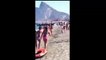 Drug dealers unloading drug on spanish beach in front of people