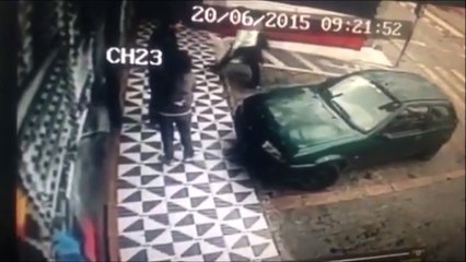 Dumb girl trying to sit on a car - FAIL