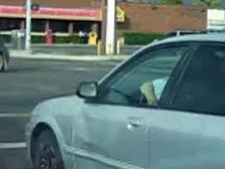 Reading a newspaper & on Her phone! Dumb Bitch!