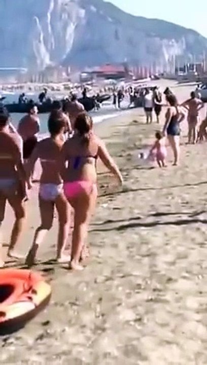 Drug dealers transporting product in front of tourists on the beach!