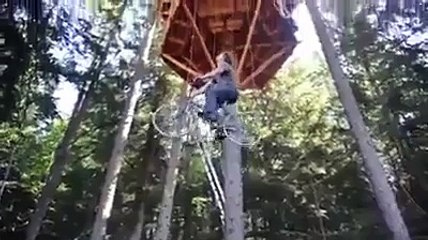 Bicycle used as a tree house elevator woooow