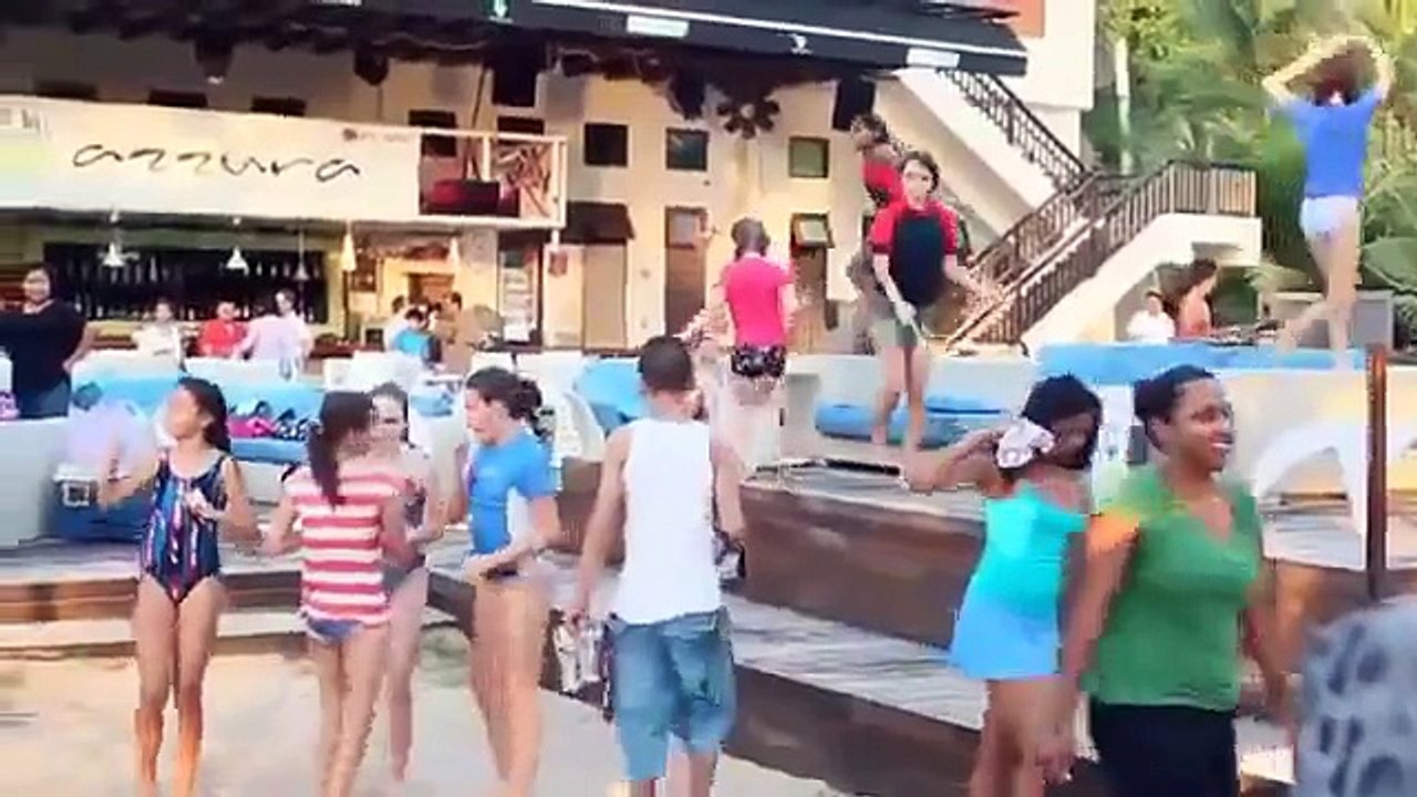 Funny Young Girls Dancing on Beach