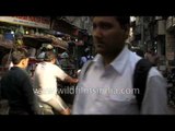 Busy rickshaw traffic on the crowded streets of Old Delhi