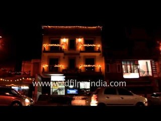 Buildings illuminate on the eve of Diwali