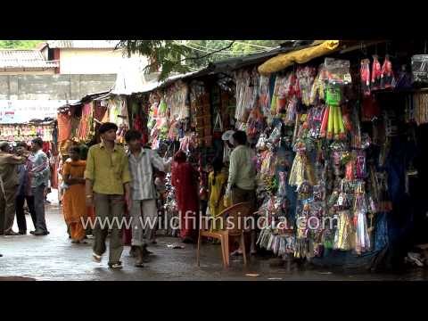 Vendors selling puja items, toys outside a temple in Alang, Gujarat