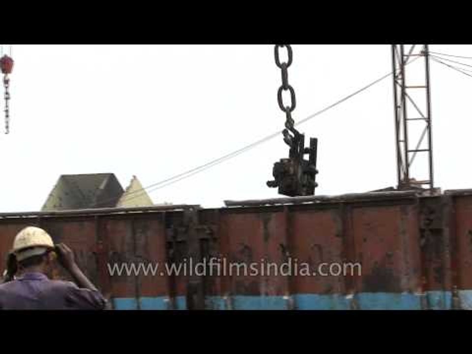 Workers in action at a ship breaking yard in Alang - India