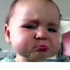Cute baby tries not to cry