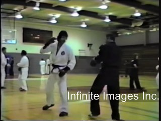 Bill Superfoot Wallace kicks students ass.