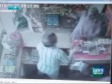 CCTV Footage Shows Brave Shopkeeper Tackles Robbers