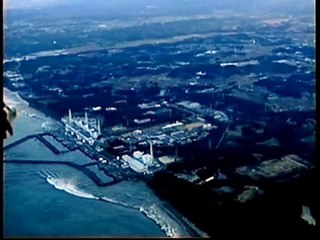 Aerial footage shows tsunami wave and Fukushima damage