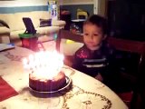 Aidan blowing out candles