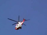 Seaking Norwegian rescue helicopter flying over Oslo city