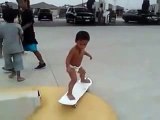 2 years old baby skateboarding with his baby pants on :P