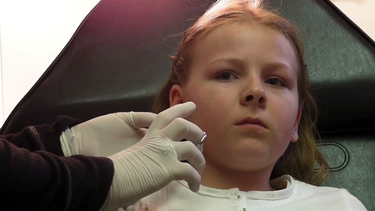 Sunny's needle ear piercing (HD)