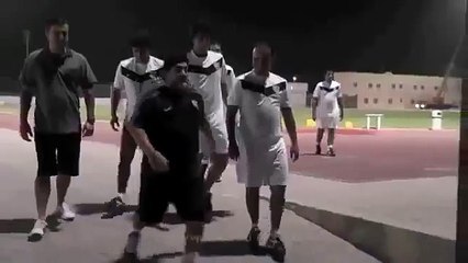 Diego Maradona wearing a Palestine scarf and cheering "VIVA PALESTINA!"